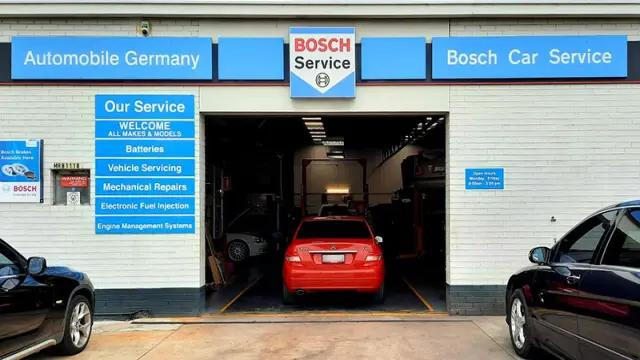 A car is driving into Bosch Car Service Bayswater workshop for routine maintenance.
