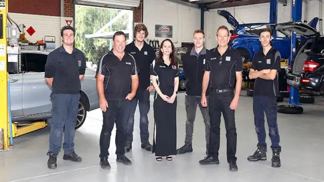 Bosch Car Service Team at Burswood Workshop - Expert mechanics standing in their workshop, ready to provide top-quality car services.