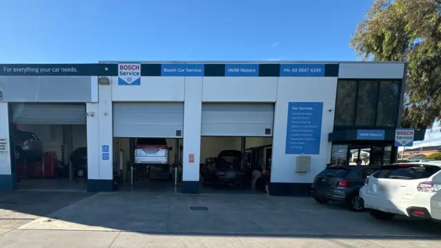 Front view of IWIM Motors workshop with clear signage, representing reliable car mechanic services in Clayton.