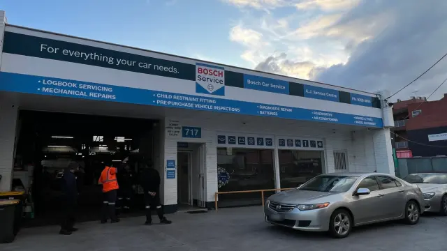 Street view of AJ Service Centre's workshop front in Coburg, showcasing the service icons and Bosch Car Service branding.